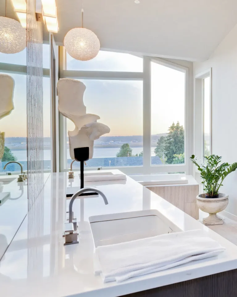 Bathroom vanity and bathtub beside a large window, pictured on Premier's website